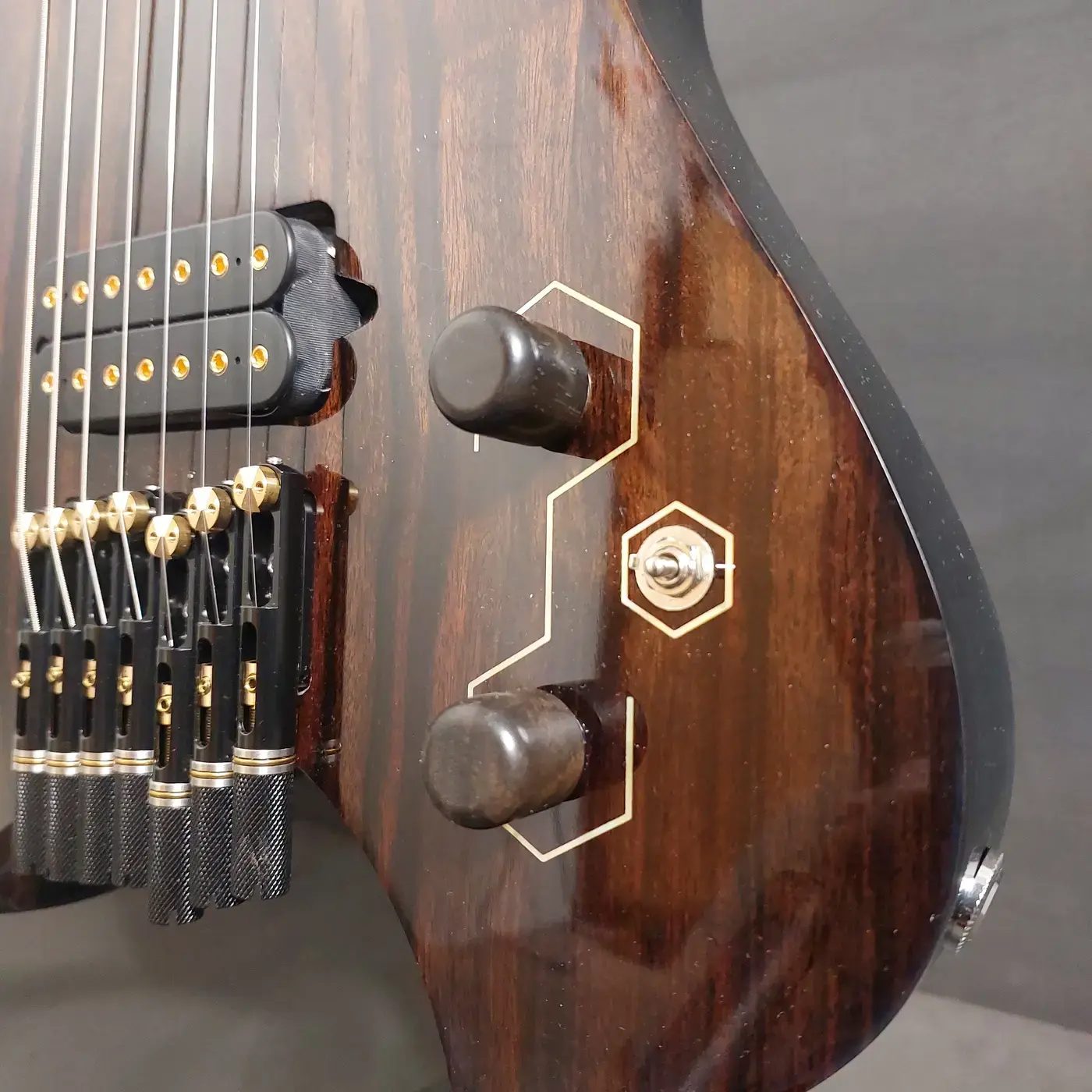 Nava Tabare controls with hexagon inlay detail